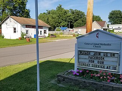 Geneva United Methodist Church sign and Mary's Grocery Store
